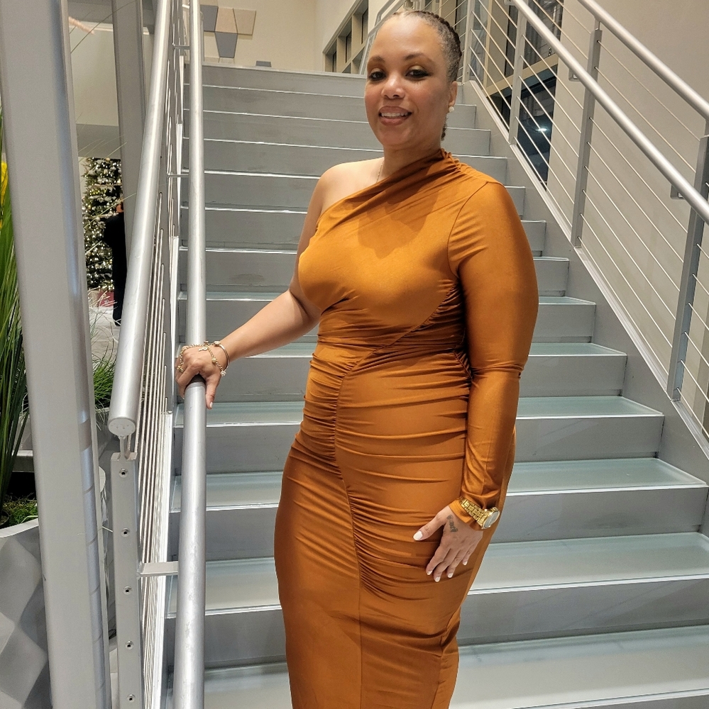 Body con one shoulder gown. Beautiful color between bronze and deep orange.